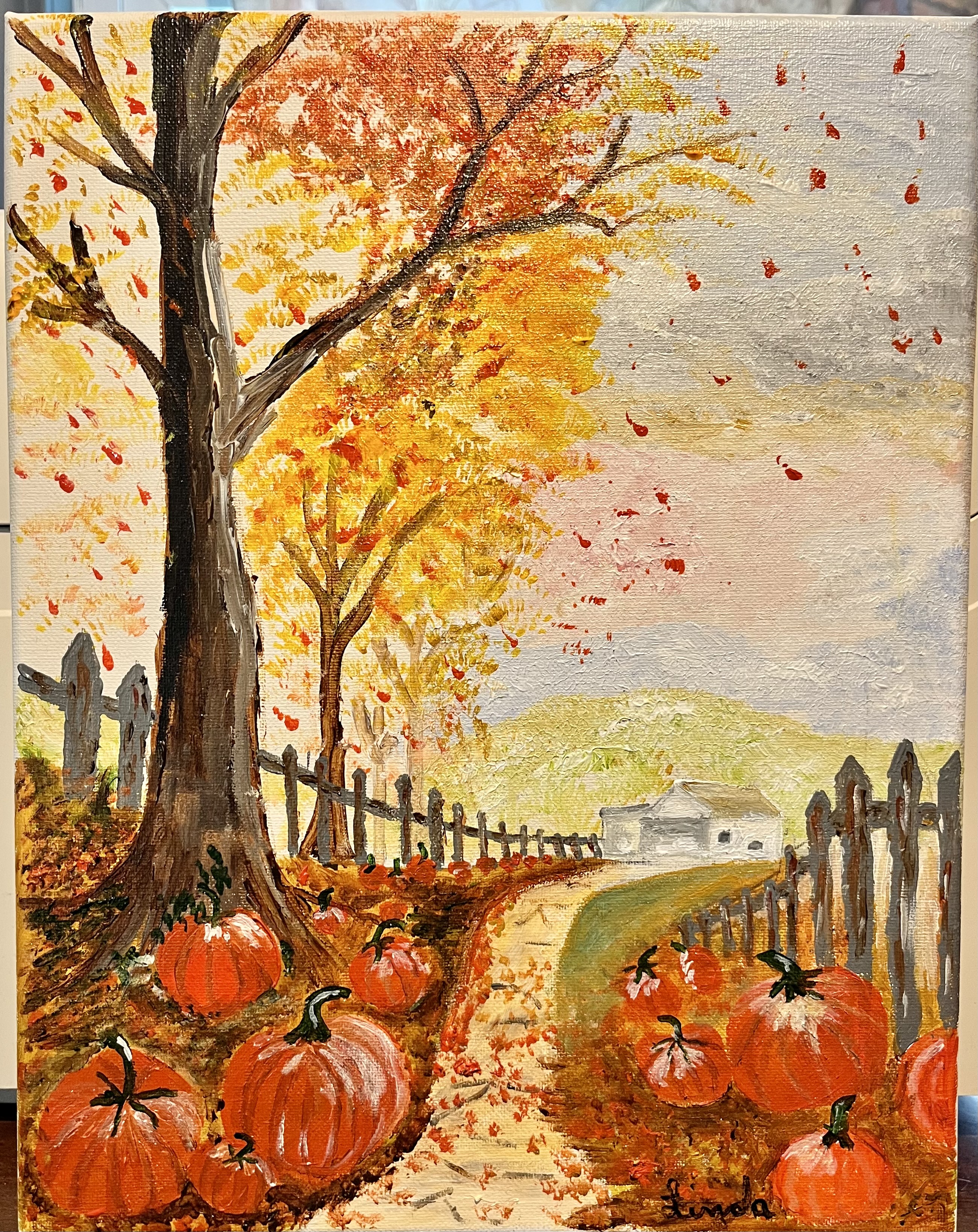 fall scene with leaves and pumpkins