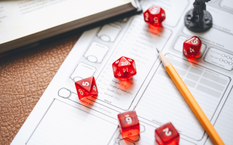 role playing dice on a character sheet