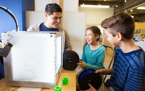 youth using 3d printer