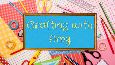 Background of crafting supplies with gold frame in the center with a blue backdrop and the text "Crafting with Amy"