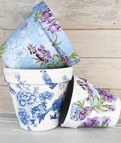 Picture of three pots decorated with decoupage