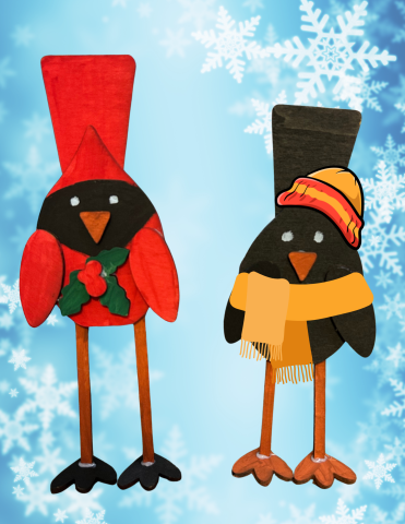 Painted wood cardinal and black bird on a blue snowflake background